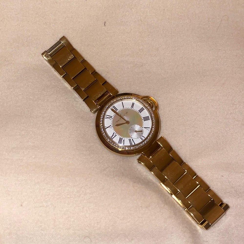Christian Van Sant gold round watch with crystal halo